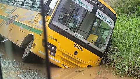 Bengaluru: Narrow escape for 20 kids as school bus gets stuck in waterlogged crater