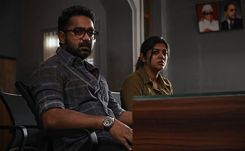 Actors Asif Ali and Aparna Balamurali in a tense scene from Jeethu Joseph’s Malayalam thriller Mirage, seated indoors with serious expressions.