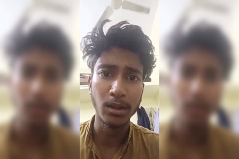 A man with tousled hair and a slight beard looks directly at the camera with a concerned expression. The image is divided into three vertical columns; the center column shows him clearly, while the left and right columns are blurred versions of the same image.