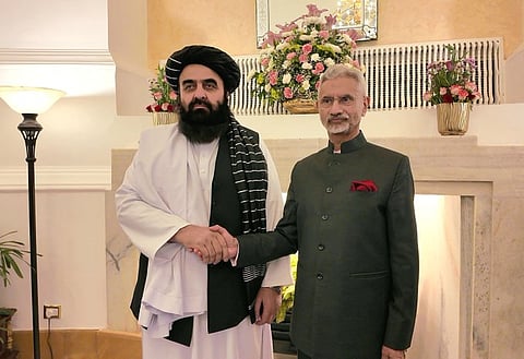Taliban-controlled Afghanistan's Foreign Minister Amir Khan Muttaqi with India's External Affairs Minister S Jaishankar. They are shaking hands and posing for a photo