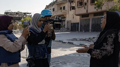 Palestinian photojournalist, Doaa al Baz, works on the streets in Gaza in September 2024. 