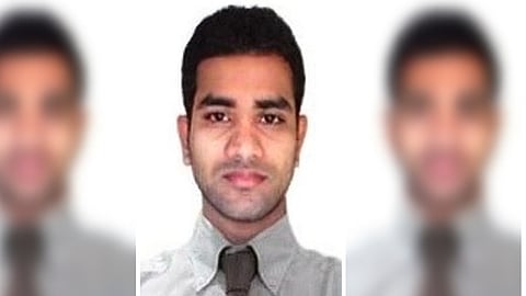 A three-panel vertical collage showing the same man in all three sections. The center image is sharp and clear, showing him facing forward in a light gray shirt and dark tie. The left and right panels are the same photo but heavily blurred, keeping only the colors and general shapes visible.