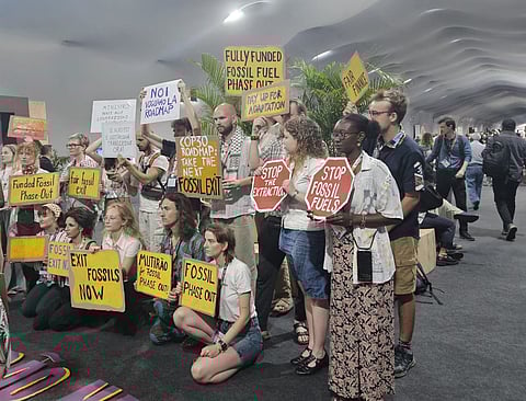 A protest inside COP venue seeking fossil fuel phase out