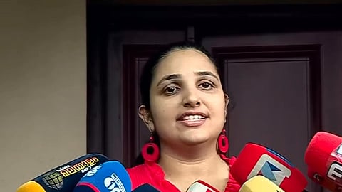 Rini Ann George speaking to the media 