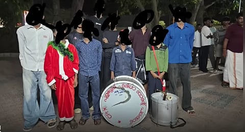 The carol group who were attacked in Kerala's Palakkad pose for a picture with their damaged drum. Their faces have been blacked out