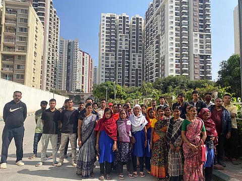 Unix employees standing outside Candeur Signature apartments