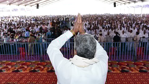 Karnataka Chief Minister Siddaramaiah greets his supporters at a gathering