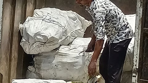A worker at Seelampur’s e-waste market