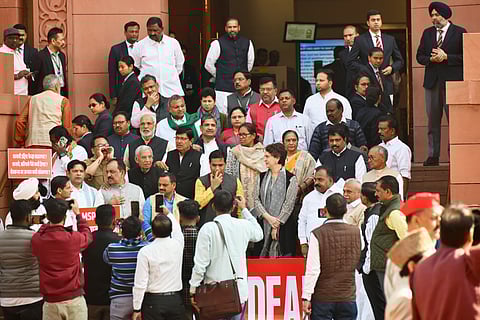 Senior Congress party leader Priyanka Gandhi Vadra, center, hands crossed, joins other members of the opposition during a protest against the India-US trade deal outside the Parliament in New Delhi, India, Thursday, Feb. 12, 2026. 