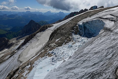A view taken from a rescue helicopter of the Punta Rocca glacier near Canazei, in the Italian Alps in northern Italy, Tuesday, July 5, 2022. 
