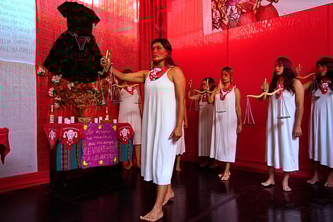Demonstrators perform representing the female victims of a forced sterilization program under the administration of late Peruvian President Alberto Fujimori in Lima, Peru, Friday, March 6, 2026. 