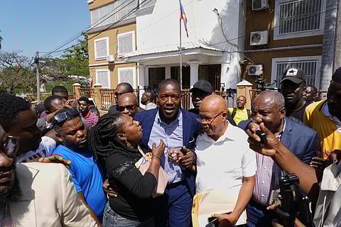 Former deputy Abel Decollines leaves after registering his political party, CAHDOA (Collective of Actors for Development and Alternative Organization), at the Provisional Electoral Council in the Petion-Ville neighborhood of Port-au-Prince, Haiti, Thursday, March 12, 2026. 