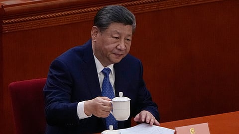 Chinese President Xi Jinping holds his cup of tea during the opening of the Chinese People's Political Consultative Conference at the Great Hall of the People, in Beijing, China, Wednesday, March 4, 2026. (AP Photo/Andy Wong)

