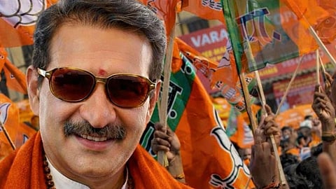 A stylised image of BJP candidate B Gopalakrishnan wearing saffron attire and rudraksha beads, smiling at the camera, juxtaposed against a campaign event with supporters holding BJP flags in the background.