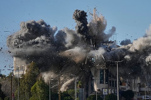 Smoke rises after an Israeli airstrike hits a building near the airport road in Beirut, Lebanon, Tuesday, March 31, 2026. 