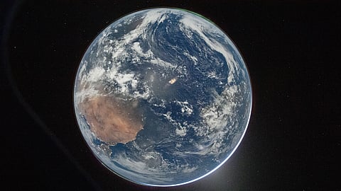 This image provided by NASA shows a view of Earth taken by NASA astronaut and Artemis II Commander Reid Wiseman from of the Orion spacecraft's window after completing the translunar injection burn on April 2, 2026. (NASA via AP)

