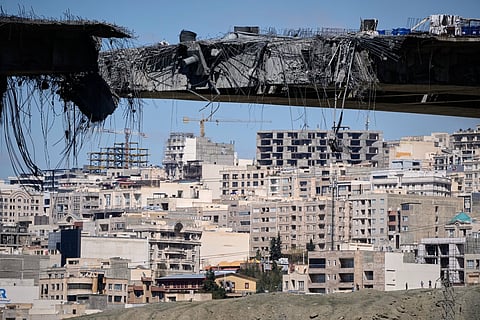 A bridge struck by U.S. airstrikes on Thursday is seen in the town of Karaj, west of Tehran, Iran, Friday, April 3, 2026. (AP Photo/Vahid Salemi)

