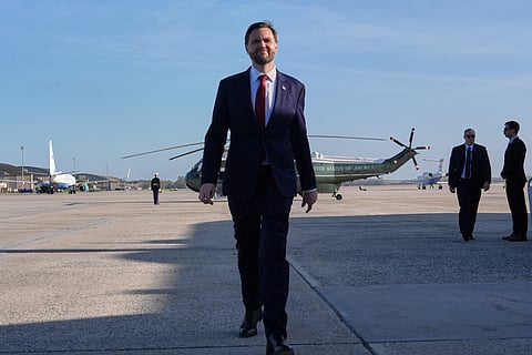 Vice President JD Vance walks to speak with the Press before boarding Air Force Two, Friday, April 10, 2026, at Joint Base Andrews, Md., for expected departure to Pakistan, for talks on Iran. (AP Photo/Jacquelyn Martin, pool)

