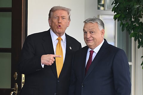 President Donald Trump, left, greets Hungary's Prime Minister Viktor Orban at the White House, Friday, Nov. 7, 2025, in Washington. 
