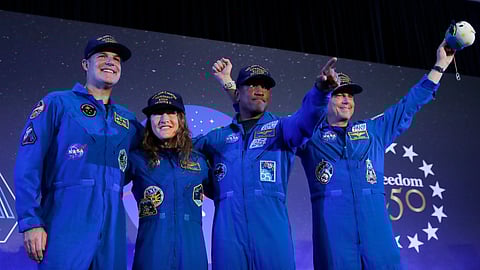 The Artemis II crew, from left, Jeremy Hansen, Christina Koch, Victor Glover and Reid Wiseman come to the center stage at the end of a crew return event Saturday, April 11, 2026, at Ellington Field in Houston. (AP Photo/Michael Wyke)

