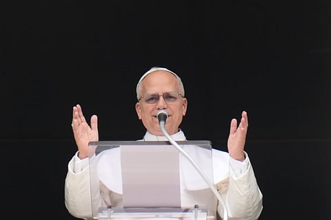 Pope Leo XIV delivers the Regina Coeli prayer in St. Peter's Square at the Vatican, Sunday, April 12, 2026. (AP Photo/Gregorio Borgia)

