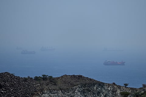 Tankers and bulk carriers anchored in the Strait of Hormuz, Saturday, April 18, 2026.
