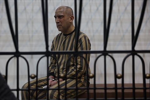Atef Najib, former head of the Political Security Branch in the Daraa area during Bashar Assad's rule, sits in the defendants' cage during a trial session at the Palace of Justice in Damascus, Syria, Sunday, April 26, 2026. 
