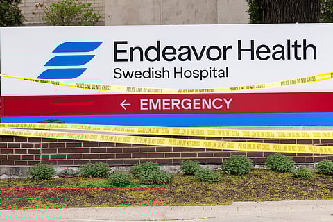 Tape covers the area outside of Endeavor Health Swedish Hospital in Chicago, Saturday, April 25, 2026, after a shooting.