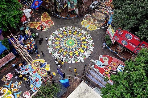 In pictures: Kolkata celebrates Durga Puja, create one-kilometer long floor art