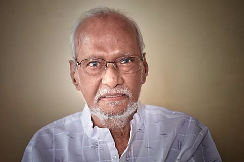 Director GN Rangarajan in a white shirt and specs.
