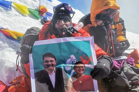 Young tribal man scales Everest, holds up pic of Telangana officials who helped him