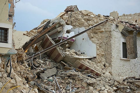 Falling wall killed his mother, sisters, but 5-year-old Shifan survived by hiding under a table