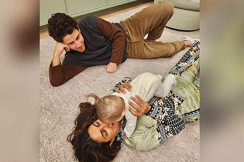 Priyanka Chopra and Nick Jonas with their daughter