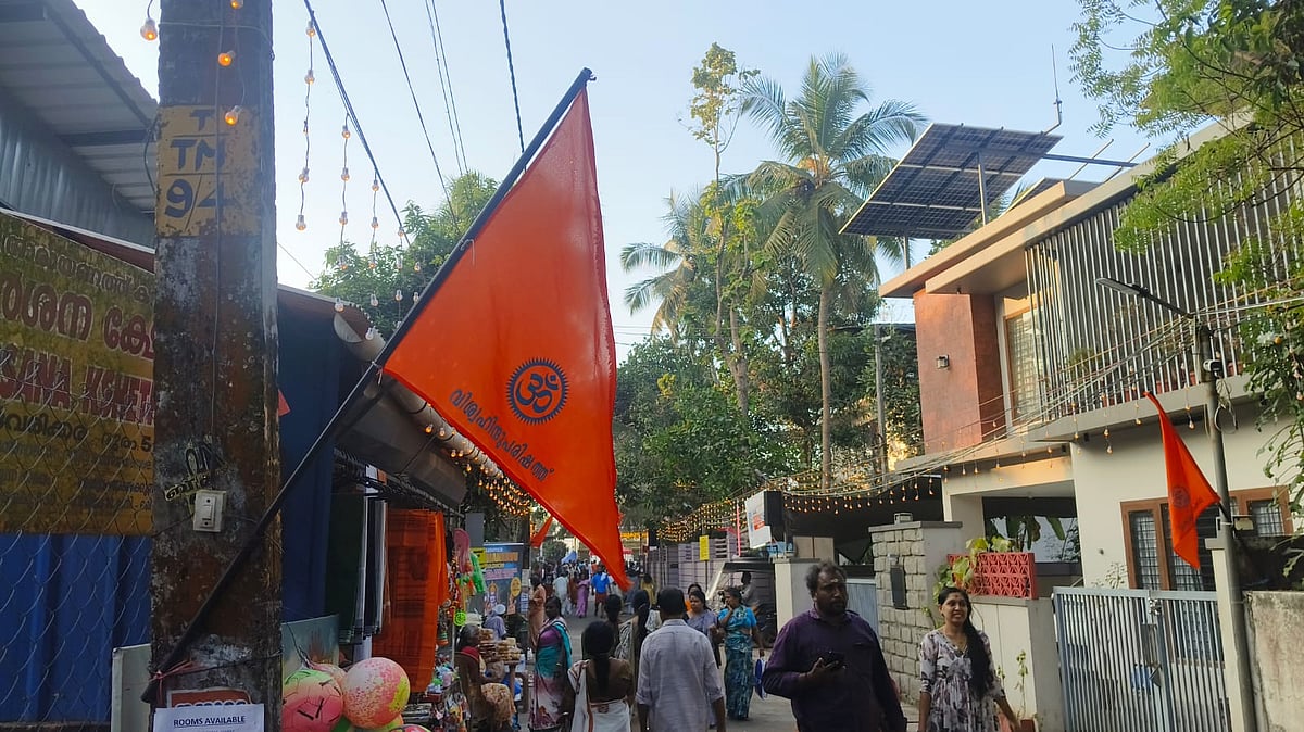 A narrow road leading to Navamukunda Temple in Tirunavaya festooned with VHP flags
