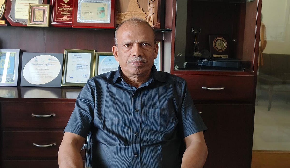 Dr K Selvaraj in a dark blue shirt. 