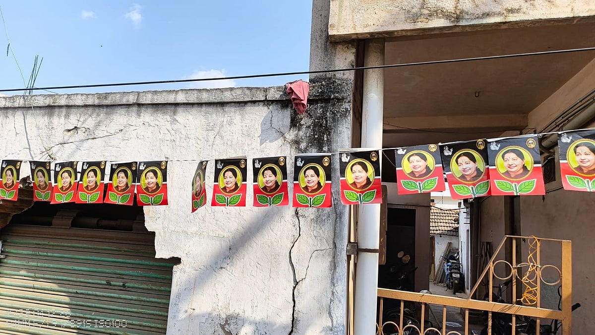Posters of Jayalalitha and the AIADMK's 'two leaf' symbol