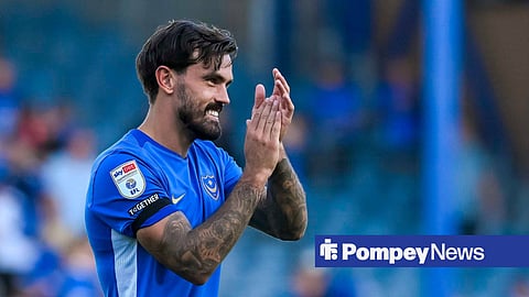 Marlon Pack applauding while in action for Portsmouth