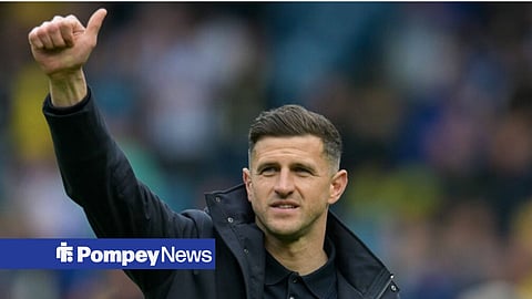 John Mousinho with his thumb in the air