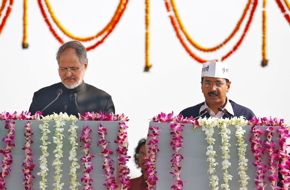 Lt Governor Najeeb Jung (left) with Delhi CM Arvind Kejriwal (right). (Photo: Reuters)
