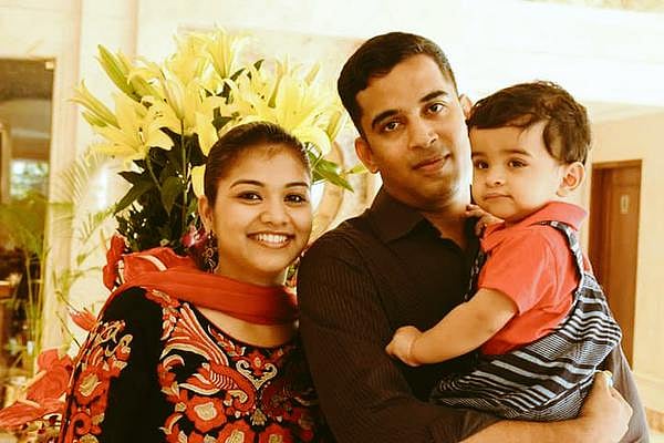File photo of missing Dornier pilot Subash Suresh, with wife Deepa Subash and their one year old child. Photo: (<a href="https://twitter.com/deepa_subash">Twitter/@deepa_subash</a>)