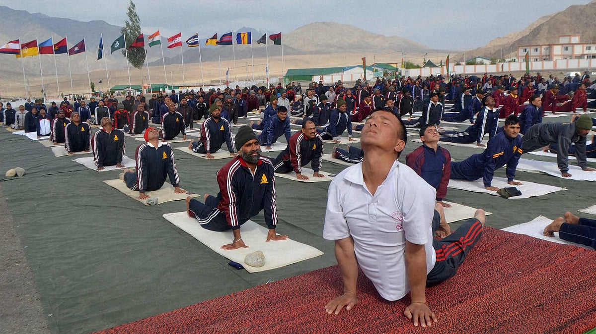 Leh : Army personnel at a Yoga session on International  Day of Yoga in Leh. (Photo: PTI)