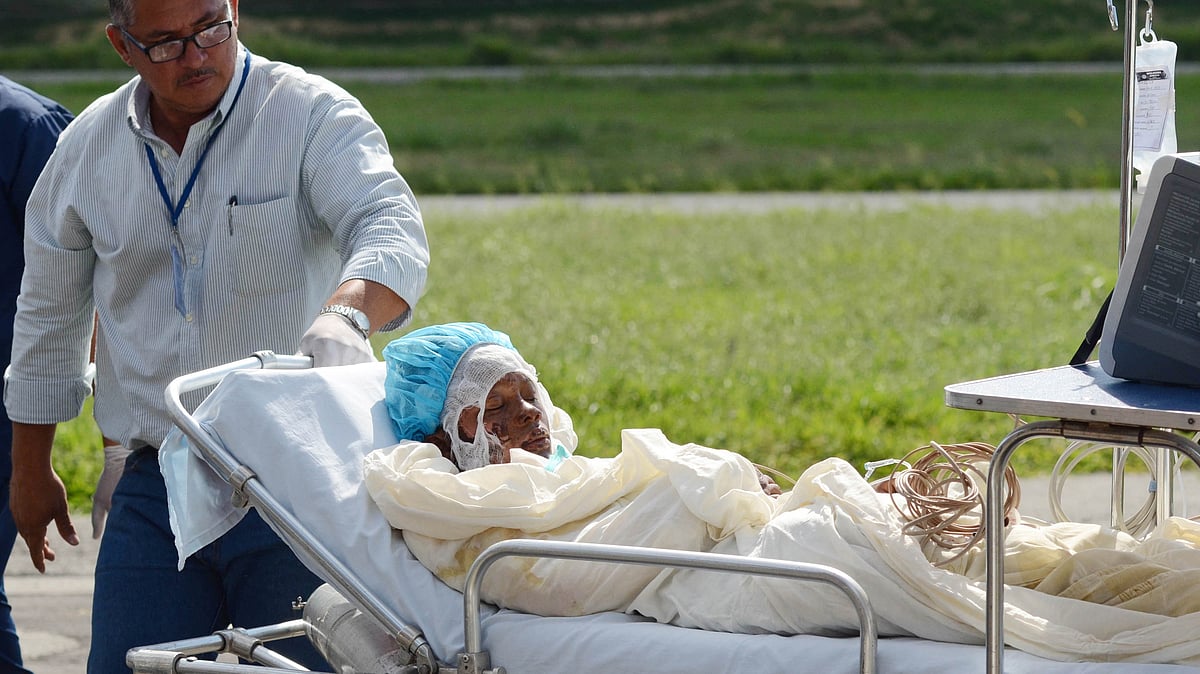 Maria Nelly Murillo lies on a stretcher after being flown to Medellin, Colombia, for medical treatment. (Photo: AP)