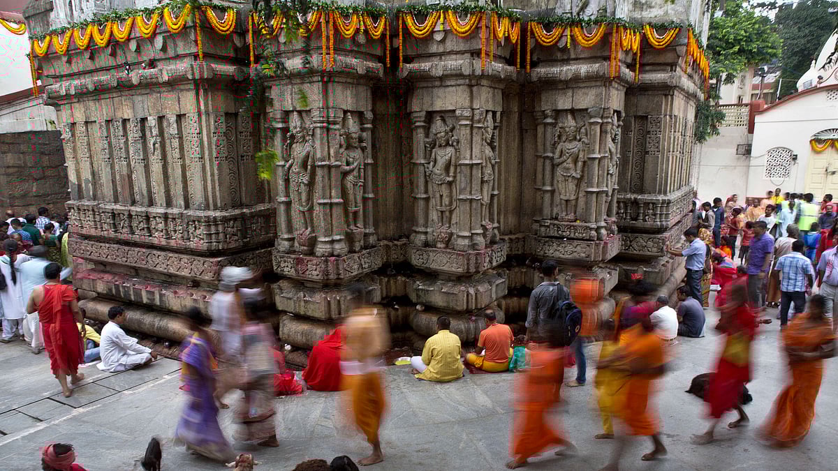 Hindu holy men walk during a procession on the
eve of the Ambubachi festival (Photo: AP)
