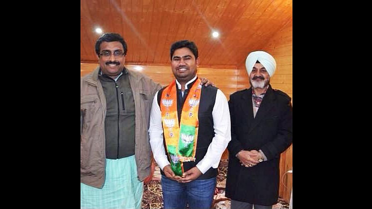 Charles Martin with BJP leaders Ram Madhav. (Photo: <i>Junior Vikatan</i>)