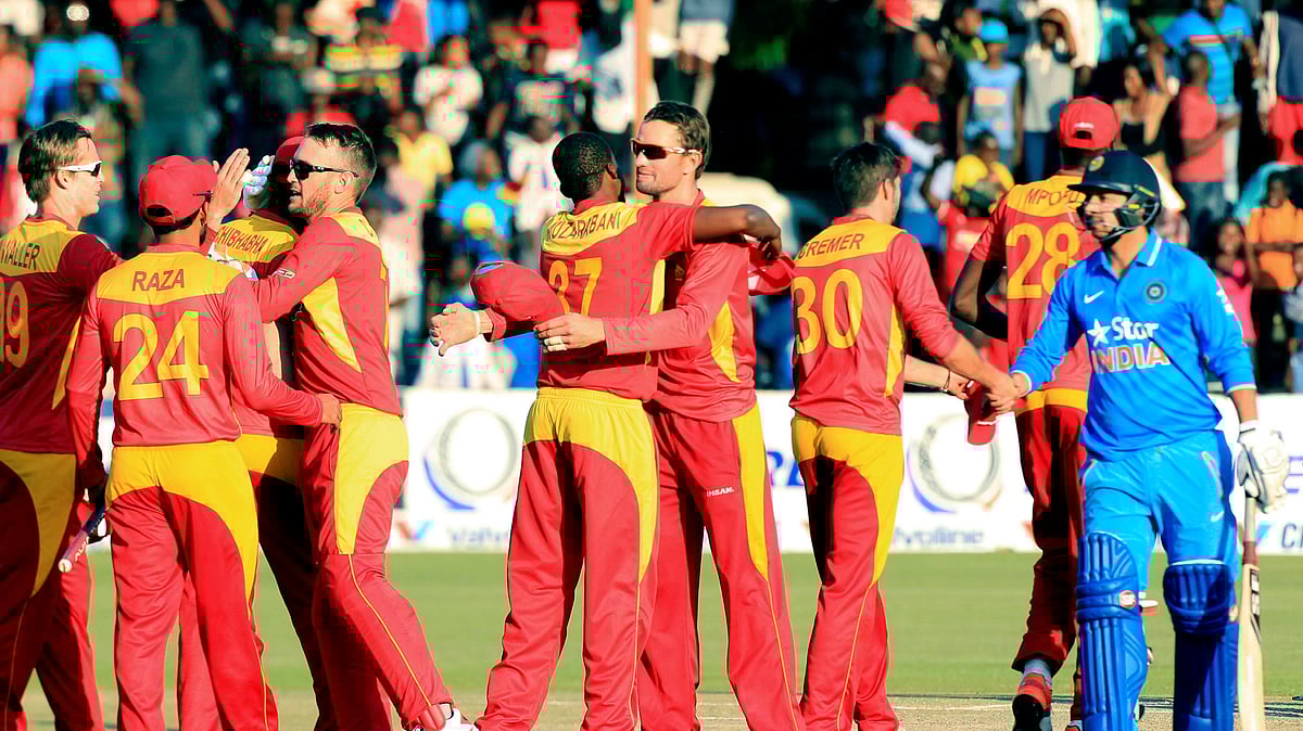 Zimbabwean players celebrate after beating India in their Twenty20 cricket match in Harare. (Photo: AP)<a></a>