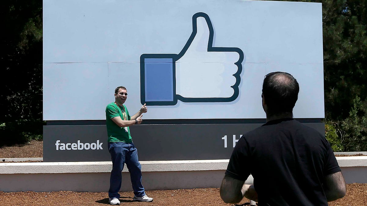 Aman poses for photographs in front of the Facebook sign on the Facebook campus in Menlo Park, California. (Photo:AP Photo)