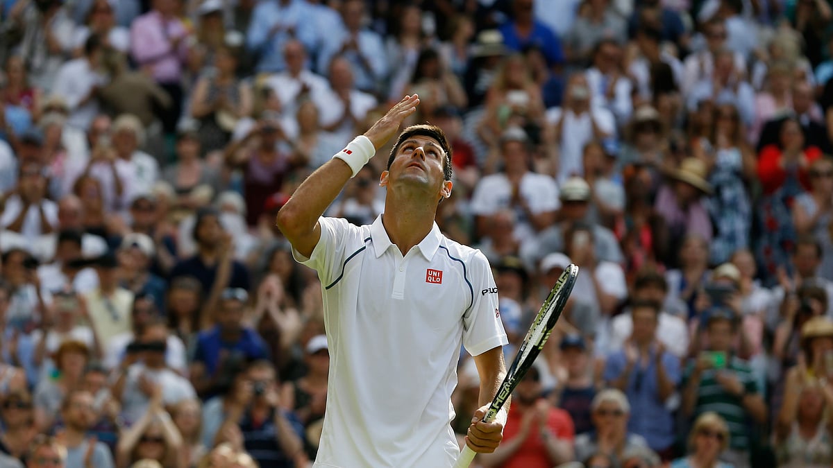 Novak Djokovic reacts after winning a point in his third round match against Bernard Tomic. (Photo: AP)