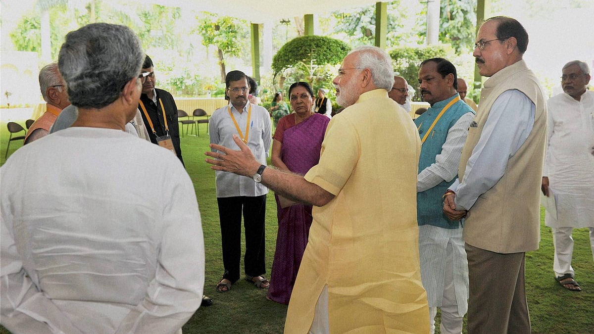 Prime Minister Narendra Modi speaks with Chief Ministers at the NITI Aayog meeting. (Photo: PTI)