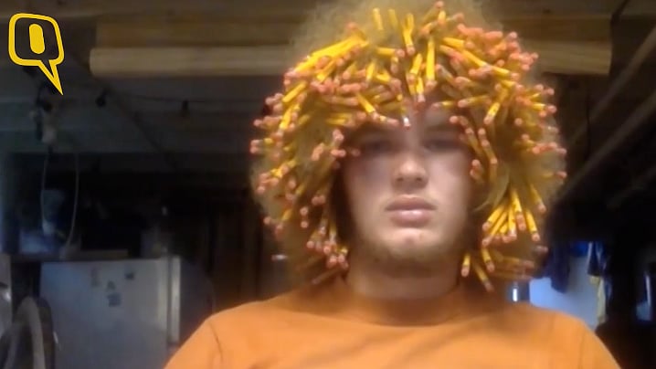 Derek Harmes managed to place 288 unsharpened size 2 pencils into his large Afro. (Photo: AP screengrab)