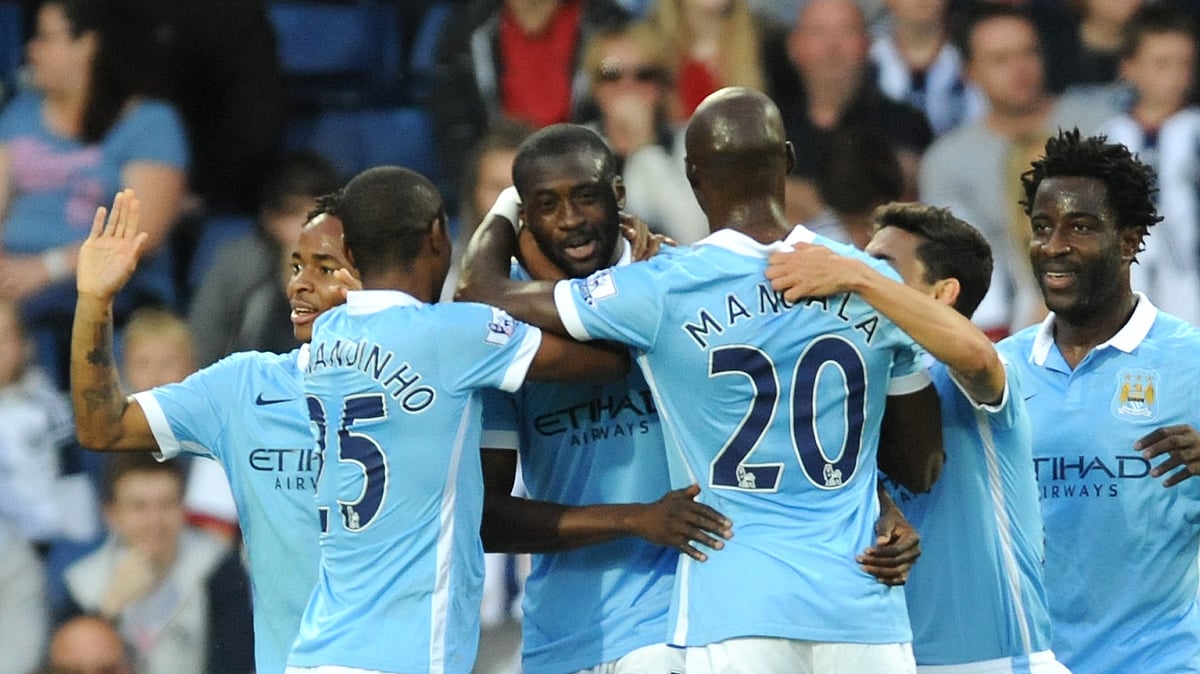 Manchester City’s Yaya Toure, third from left, celebrates with his team mates after scoring against West Brom. (Photo: AP)